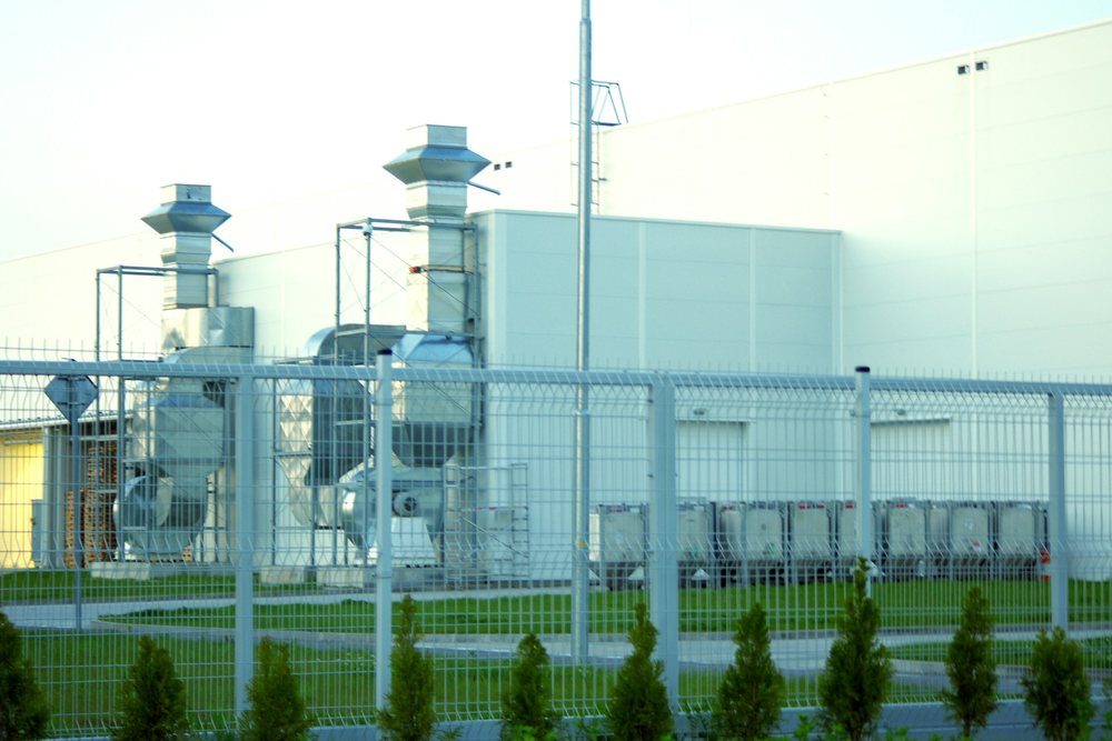 Clean white industrial building with ventilation stacks