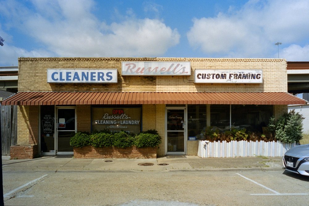 Single-story retail building with brick facade and storefront awning
